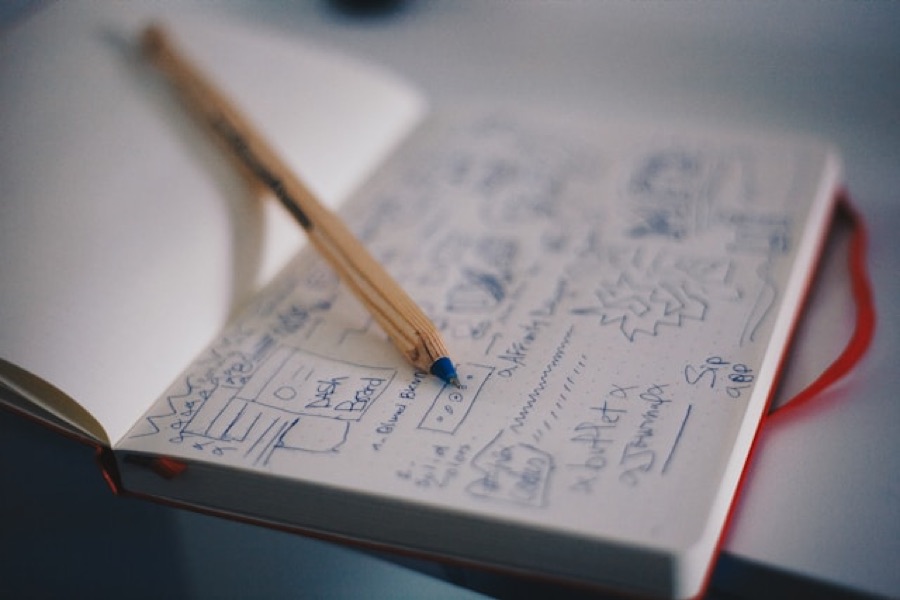 A notebook of hand-drawn layout sketches